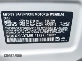 2021 BMW X1 xDrive28i with VIN WBXJG9C07M5U21337, listed as a IAAI auction lot 42590859 with 35,934 mi miles and . Bid and sale history available at DreamBid. Image 9.