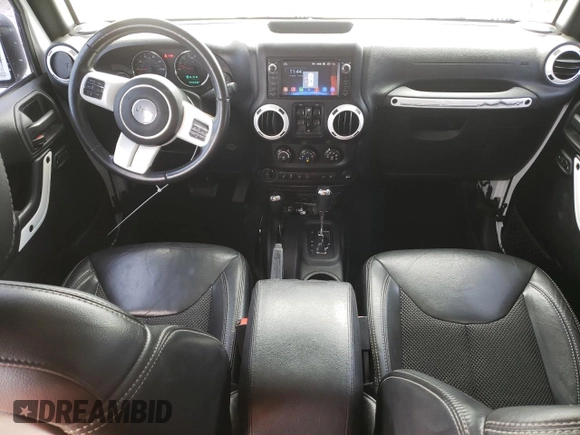 2015 Jeep Wrangler Unlimited Wrangler X with VIN 1C4BJWEG6FL614671, listed as a Copart auction lot 62286095 with 94,928 mi miles and Salvage title. Bid and sale history available at DreamBid. Image 8.