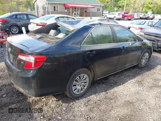 2014 Toyota Camry L with VIN 4T4BF1FK7ER395057, listed as a IAAI auction lot 42215441 with 166,247 mi miles and . Bid and sale history available at DreamBid. Image 4.