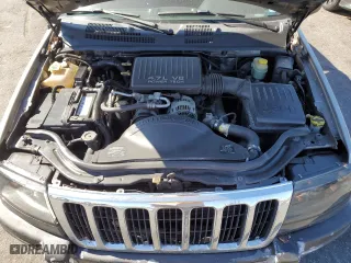 1999 Jeep Grand Cherokee Laredo with VIN 1J4GW58N4XC739465, listed as a Copart auction lot 76130544 with 195,649 mi miles and Salvage Title. Bid and sale history available at carsss.com. Image 12.