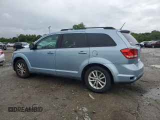 2013 Dodge Journey SXT with VIN 3C4PDCBG0DT619382, listed as a Copart auction lot 56565205 with 176,112 mi miles and Salvage title. Bid and sale history available at DreamBid. Image 2.