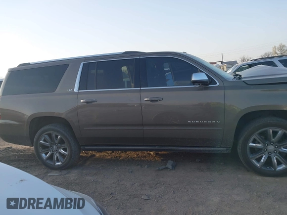 2015 Chevrolet Suburban LTZ with VIN 1GNSKKKC1FR628182, listed as a IAAI auction lot 41801391 with Not Provided miles and . Bid and sale history available at DreamBid. Image 13.