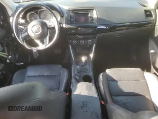 2014 Mazda CX-5 Grand Touring with VIN JM3KE4DY1E0328852, listed as a Copart auction lot 53965265 with 67,242 mi miles and Salvage Title. Bid and sale history available at DreamBid. Image 8.