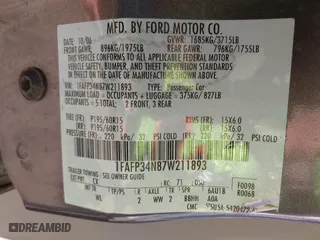 2007 Ford Focus S with VIN 1FAFP34N87W211893, listed as a IAAI auction lot 41861386 with 511,418 mi miles. Bid and sale history available at carsss.com. Image 9.
