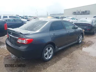 2011 Toyota Corolla L with VIN 2T1BU4EE6BC679516, listed as a IAAI auction lot 42104879 with 184,014 mi miles. Bid and sale history available at carsss.com. Image 4.