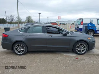 2019 Ford Fusion SEL with VIN 3FA6P0CDXKR129411, listed as a IAAI auction lot 42082323 with 126,048 mi miles and . Bid and sale history available at DreamBid. Image 13.