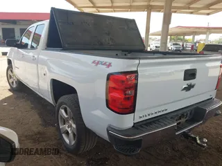 2015 Chevrolet Silverado 1500 LT with VIN 1GCVKREC1FZ415386, listed as a IAAI auction lot 42142990 with 165,409 mi miles and . Bid and sale history available at DreamBid. Image 3.