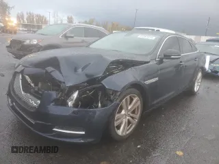 2012 Jaguar XJ with VIN SAJWA1CB7CLV28522, listed as a Copart auction lot 81587014 with 136,868 mi miles and Salvage Title. Bid and sale history available at DreamBid. Image 1.