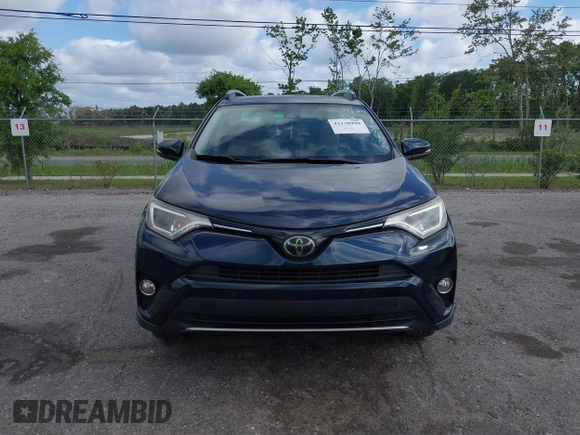 2018 Toyota RAV4 XLE with VIN JTMWFREV9JJ165655, listed as a IAAI auction lot 42138998 with 123,569 mi miles and . Bid and sale history available at carsss.com. Image 12.