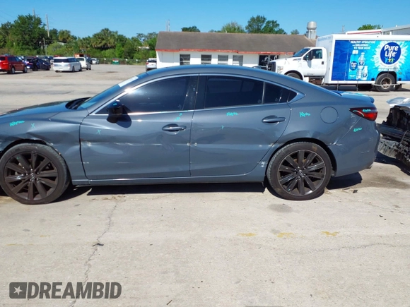 2021 Mazda 6 Carbon Edition with VIN JM1GL1WY4M1619533, listed as a IAAI auction lot 41979213 with 84,783 mi miles and . Bid and sale history available at DreamBid. Image 14.