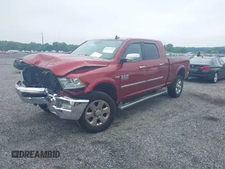 2014 Ram 2500 Laramie with VIN 3C6UR5NJ1EG276591, listed as a IAAI auction lot 42517879 with 145,466 mi miles and . Bid and sale history available at DreamBid. Image 2.