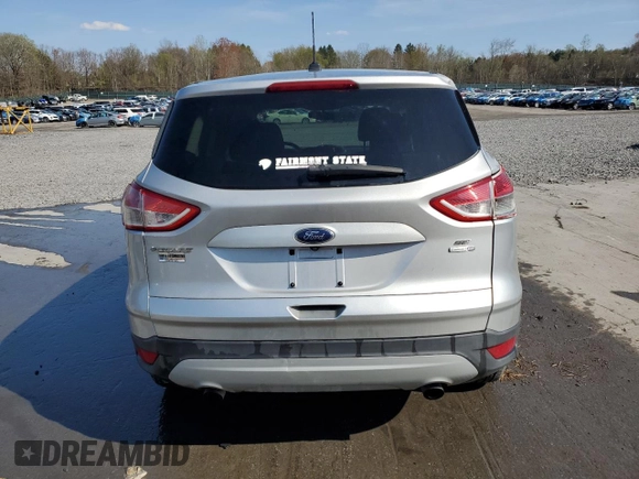 2014 Ford Escape SE with VIN 1FMCU9GX8EUA90860, listed as a Copart auction lot 54197415 with 89,098 mi miles and Salvage Title. Bid and sale history available at DreamBid. Image 6.