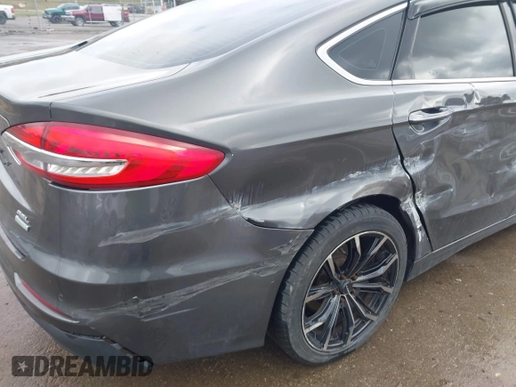 2019 Ford Fusion SEL with VIN 3FA6P0CD6KR141832, listed as a IAAI auction lot 41800102 with 142,282 mi miles and . Bid and sale history available at DreamBid. Image 21.
