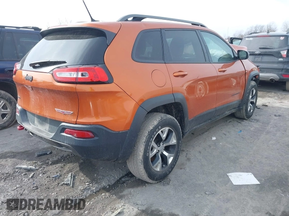 2015 Jeep Cherokee Trailhawk with VIN 1C4PJMBB3FW642266, listed as a IAAI auction lot 41510571 with 72,030 mi miles and . Bid and sale history available at DreamBid. Image 4.