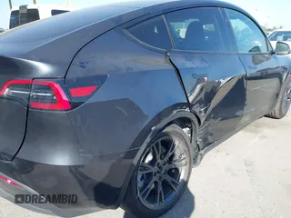 2025 Tesla Model Y Long Range with VIN 7SAYGDED2SF228414, listed as a IAAI auction lot 41706470 with 11,319 mi miles and . Bid and sale history available at DreamBid. Image 6.