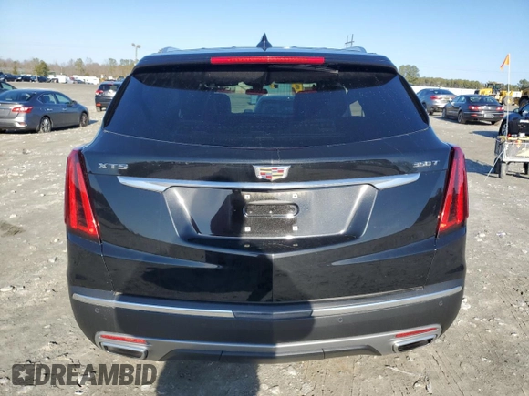 2023 Cadillac XT5 FWD Premium Luxury with VIN 1GYKNCR48PZ132957, listed as a Copart auction lot 42132845 with 27,312 mi miles and Salvage Title. Bid and sale history available at carsss.com. Image 6.
