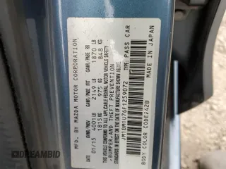 2015 Mazda 3 i Sport z VIN JM1BM1U76F1259072, wystawiony jako Copart lot #53812045 z przebiegiem 41 455 mil mil oraz Szkoda całkowita • Salvage title. Historia ofert i sprzedaży dostępna na DreamBid. Obrazek 13.