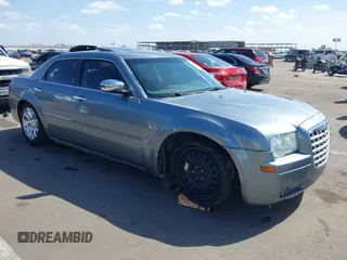 2006 Chrysler 300 C with VIN 2C3KA63H56H313967, listed as a IAAI auction lot 42056998 with 143,592 mi miles and . Bid and sale history available at carsss.com. Image 1.