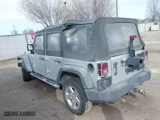 2010 Jeep Wrangler Unlimited Sport with VIN 1J4BA3H10AL112599, listed as a IAAI auction lot 41739263 with 156,301 mi miles. Bid and sale history available at carsss.com. Image 3.