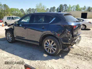 2019 Mazda CX-5 Grand Touring with VIN JM3KFBDMXK0540725, listed as a Copart auction lot 52395185 with 33,838 mi miles and Salvage Title. Bid and sale history available at carsss.com. Image 2.