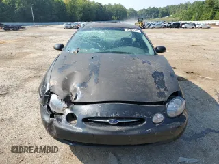 1998 Ford Taurus LX z VIN 1FAFP52U9WA174855, wystawiony jako Copart lot #66728184 z przebiegiem 104 796 mil mil oraz Szkody całkowita. Historia ofert i sprzedaży dostępna na DreamBid. Obrazek 5.