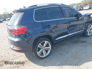 2014 Volkswagen Tiguan S z VIN WVGBV3AX7EW545538, wystawiony jako IAAI lot #42083281 z przebiegiem 129 227 mil mil oraz . Historia ofert i sprzedaży dostępna na DreamBid. Obrazek 4.