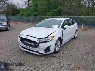 2020 Ford Fusion SE with VIN 3FA6P0LU5LR151074, listed as a IAAI auction lot 42146290 with 98,574 mi miles and . Bid and sale history available at carsss.com. Image 2.
