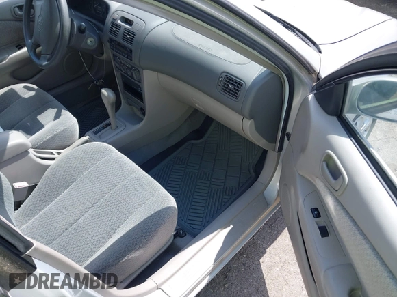2002 Toyota Corolla CE with VIN 1NXBR12E12Z581660, listed as a IAAI auction lot 42654124 with 115,950 mi miles and . Bid and sale history available at DreamBid. Image 5.