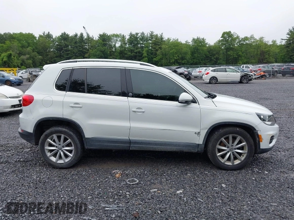 2017 Volkswagen Tiguan Wolfsburg Edition with VIN WVGRV7AX9HK002659, listed as a IAAI auction lot 42482438 with 88,841 mi miles and . Bid and sale history available at DreamBid. Image 13.