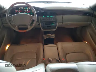2001 Cadillac DeVille DHS z VIN 1G6KE57Y41U150631, wystawiony jako Copart lot #61805295 z przebiegiem 96 158 mil mil oraz Czysty tytuł • Clean title. Historia ofert i sprzedaży dostępna na DreamBid. Obrazek 8.