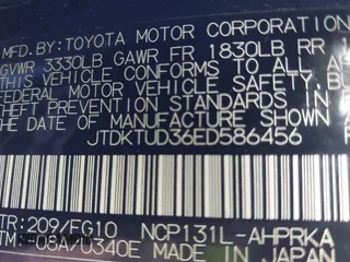 2014 Toyota Yaris L with VIN JTDKTUD36ED586456, listed as a IAAI auction lot 41888730 with 92,742 mi miles. Bid and sale history available at carsss.com. Image 9.