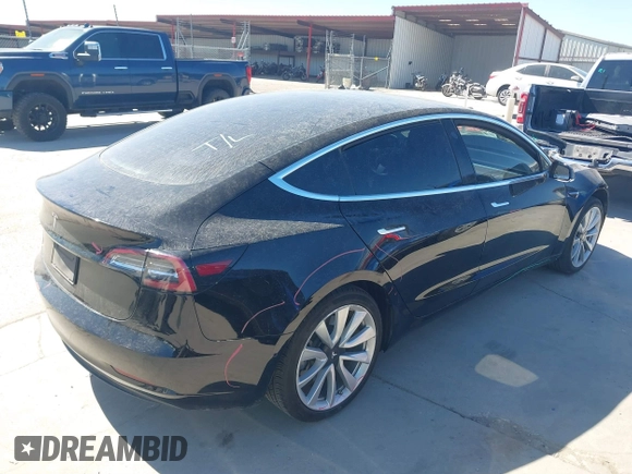 2020 Tesla Model 3 Standard Range Plus with VIN 5YJ3E1EAXLF614002, listed as a IAAI auction lot 41758898 with 42,363 mi miles and . Bid and sale history available at DreamBid. Image 4.
