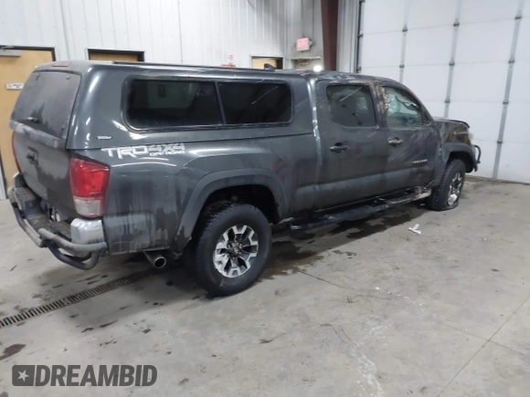 2016 Toyota Tacoma SR5 with VIN 3TMDZ5BNXGM009423, listed as a IAAI auction lot 41008068 with 107,426 mi miles and . Bid and sale history available at DreamBid. Image 4.