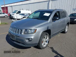 2016 Jeep Compass Sport with VIN 1C4NJCBA5GD574185, listed as a IAAI auction lot 42234955 with 127,468 mi miles and . Bid and sale history available at DreamBid. Image 2.