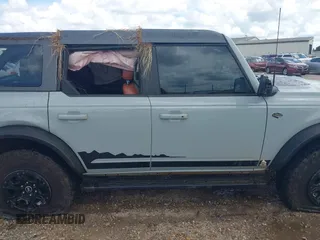 2021 Ford Bronco with VIN 1FMEE5DP6MLA61655, listed as a IAAI auction lot 42492762 with 88,313 mi miles and . Bid and sale history available at DreamBid. Image 13.