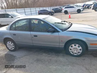 2002 Saturn SL z VIN 1G8ZH52892Z151119, wystawiony jako IAAI lot #41764757 z przebiegiem 82 017 mil mil oraz . Historia ofert i sprzedaży dostępna na DreamBid. Obrazek 13.