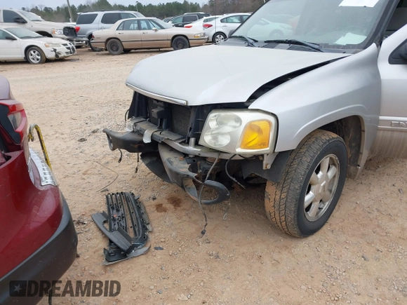 2005 GMC Envoy SLT with VIN 1GKDT13S452263166, listed as a IAAI auction lot 41543466 with 166,999 mi miles. Bid and sale history available at carsss.com. Image 6.