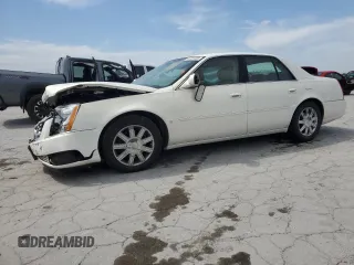 2006 Cadillac DTS 1SD z VIN 1G6KD57YX6U118647, wystawiony jako Copart lot #53701855 z przebiegiem 59 409 mil mil oraz Szkody całkowita. Historia ofert i sprzedaży dostępna na DreamBid. Obrazek 1.