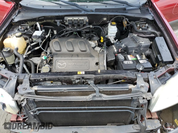 2005 Mazda Tribute S with VIN 4F2CZ04125KM19257, listed as a Copart auction lot 67370664 with 140,348 mi miles and Salvage Title. Bid and sale history available at DreamBid. Image 11.