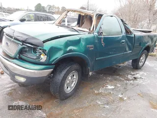 1999 Ford F-150 XL with VIN 1FTRX18L9XNA66552, listed as a IAAI auction lot 41284259 with Not provided miles and . Bid and sale history available at DreamBid. Image 2.