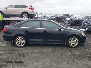 2014 Volkswagen Jetta TDI w/Premium with VIN 3VWLL7AJ1EM406360, listed as a IAAI auction lot 41857580 with 93,333 mi miles and . Bid and sale history available at DreamBid. Image 13.