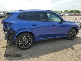 2024 BMW X1 xDrive28i with VIN WBX73EF06R5007063, listed as a Copart auction lot 56143075 with 2,947 mi miles and Salvage title. Bid and sale history available at DreamBid. Image 3.