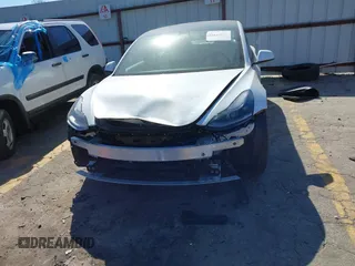 2022 Tesla Model 3 with VIN 5YJ3E1EA7NF103513, listed as a IAAI auction lot 41643592 with 35,631 mi miles and . Bid and sale history available at DreamBid. Image 6.