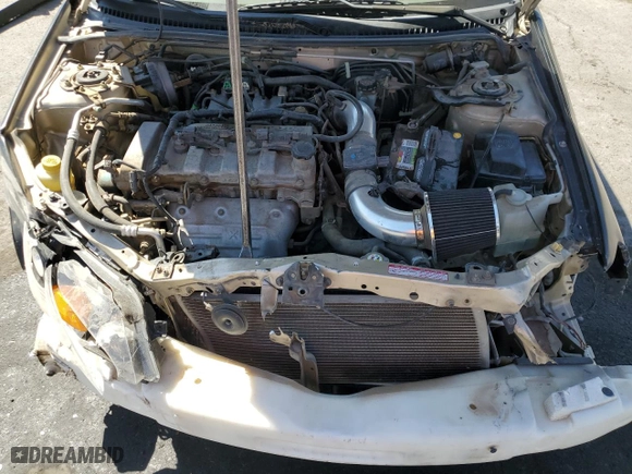 2002 Mazda Protege DX with VIN JM1BJ225121602980, listed as a Copart auction lot 73161834 with 77,314 mi miles and Salvage Title. Bid and sale history available at carsss.com. Image 11.