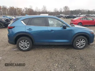 2023 Mazda CX-5 S Carbon Edition z VIN JM3KFBCM4P0264891, wystawiony jako IAAI lot #40933700 z przebiegiem 18 714 mil mil oraz . Historia ofert i sprzedaży dostępna na DreamBid. Obrazek 13.