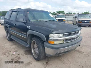 2002 Chevrolet Tahoe LT z VIN 1GNEC13Z22J335701, wystawiony jako IAAI lot #42134758 z przebiegiem 250 668 mil mil oraz . Historia ofert i sprzedaży dostępna na DreamBid. Obrazek 1.