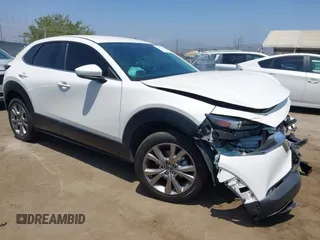 2021 Mazda CX-30 Select with VIN 3MVDMBBL9MM313039, listed as a IAAI auction lot 42575424 with 21,083 mi miles and . Bid and sale history available at DreamBid. Image 1.