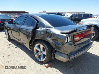 2014 Dodge Charger SXT z VIN 2C3CDXHG3EH339404, wystawiony jako IAAI lot #42072957 z przebiegiem 125 183 mil mil oraz . Historia ofert i sprzedaży dostępna na DreamBid. Obrazek 3.