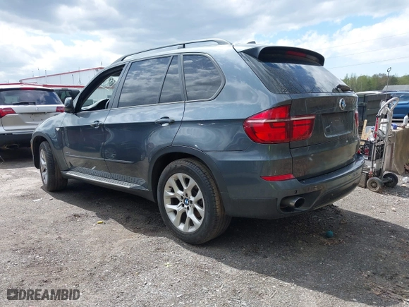 2011 BMW X5 35i with VIN 5UXZV4C56BL406632, listed as a IAAI auction lot 41981590 with 168,534 mi miles. Bid and sale history available at carsss.com. Image 3.