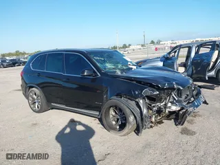 2018 BMW X5 xDrive40e iPerformance with VIN 5UXKT0C59J0W00801, listed as a IAAI auction lot 41081133 with 63,265 mi miles. Bid and sale history available at carsss.com. Image 1.